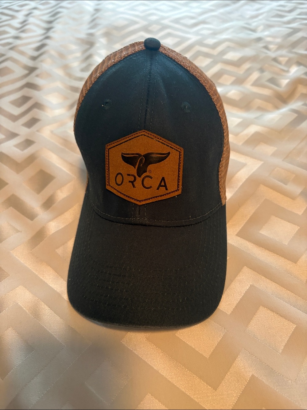 ORCA Patch Trucker Hat in Blue  and Brown